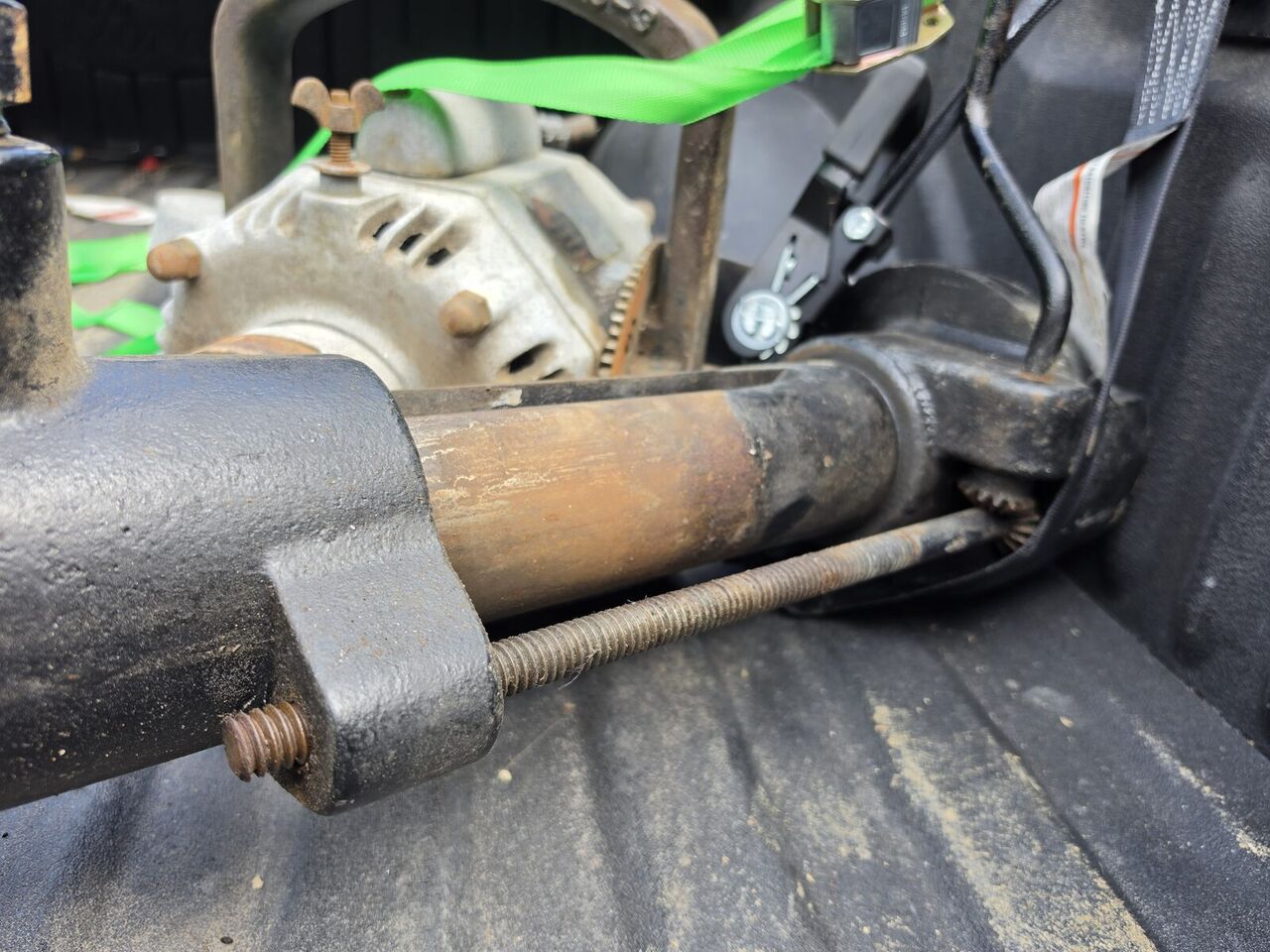 Elevation tube and threaded rod with the gear assembly, disassembled in the truck bed